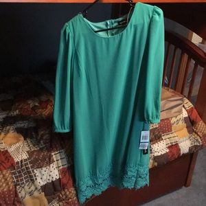 Knee length teal dress Three quarter sleeves